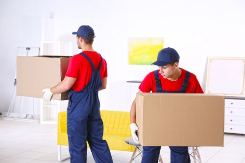 Professional office relocation planning in Roehampton with moving boxes and workspace setup