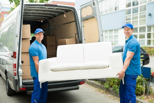 Local moving team handling boxes and furniture in Roehampton
