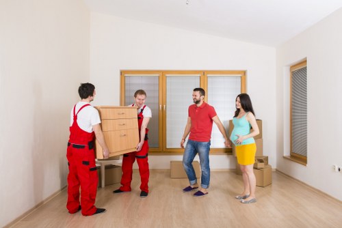 Furniture and boxes arranged for a smooth flat removal in Roehampton