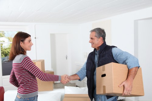 Loading furniture and boxes into a van for a move in Roehampton